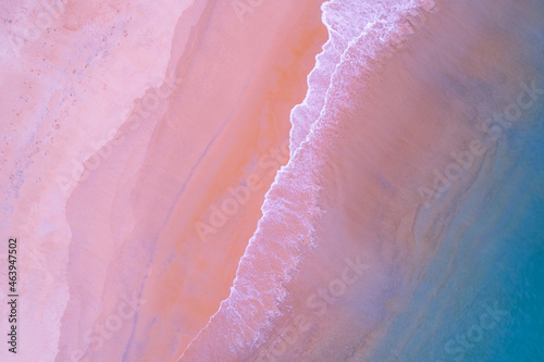 Fototapeta Naklejka Na Ścianę i Meble -  Top view of amazing pastel pink sand beach and turquoise sea copy space available nature background High angle view sea