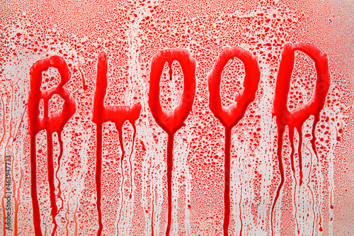 Word BLOOD and drops on lig...