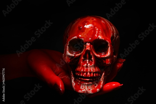 Hand with bloodstained huma...