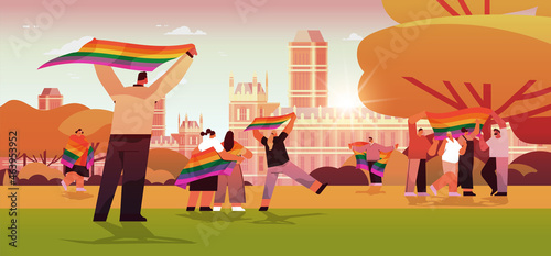 mix race people holding lgbt rainbow flags gay lesbian love parade pride festival transgender love concept