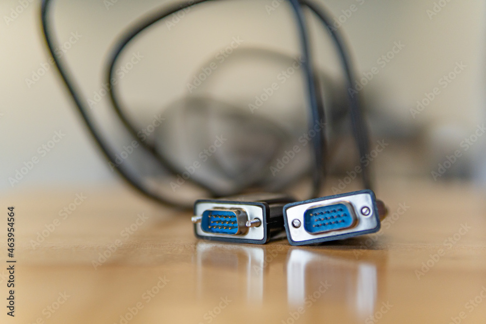 VGA Cable on office desk with connecting pins VGA Cable on office desk with connecting pins