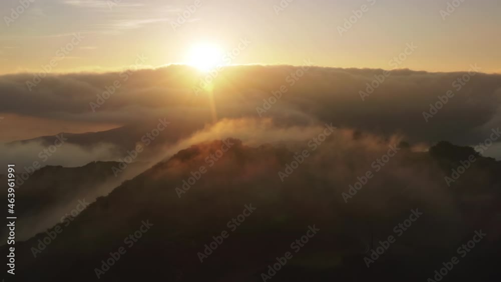 Sun shining with beautiful rays and lens flare 4K. Flying through heavenly beautiful golden sunny cloudscape above mountain peak at sunset. Amazing timelapse of golden fluffy clouds moving Sun shining with beautiful rays and lens flare 4K. Flying through heavenly beautiful golden sunny cloudscape above mountain peak at sunset. Amazing timelapse of golden fluffy clouds moving