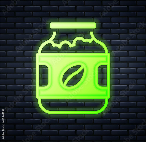 Glowing neon Coffee jar bottle icon isolated on brick wall background. Vector