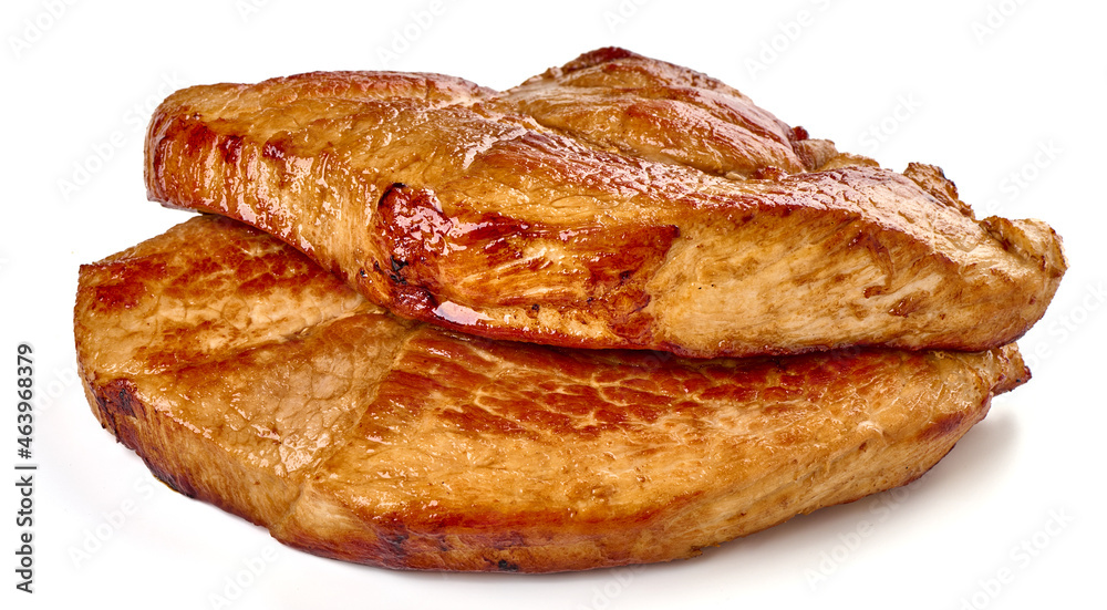 Juicy roasted pork steaks, isolated on white background.