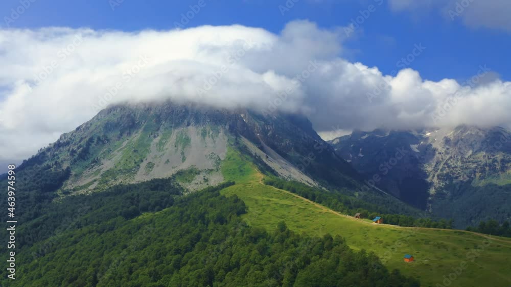 Aerial view over mountains under cloudy sky in summer day in Komovi Mountains, Montenegro. Aerial view over mountains under cloudy sky in summer day in Komovi Mountains, Montenegro.