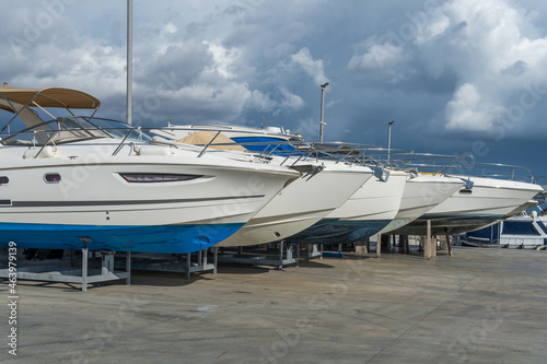 Fotografie Recreational boats supported on metal tripods for future restoration