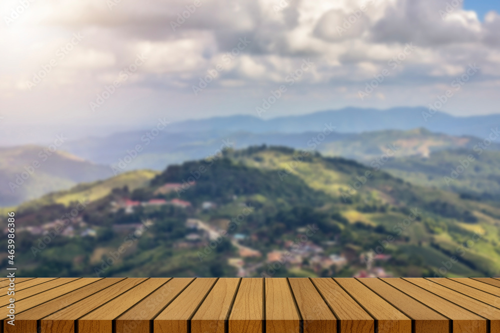 wooden table and beauty blur sky and mountains as background. wooden table and beauty blur sky and mountains as background.