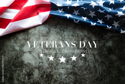 Veterans day. Honoring all who served. American flag on cement background