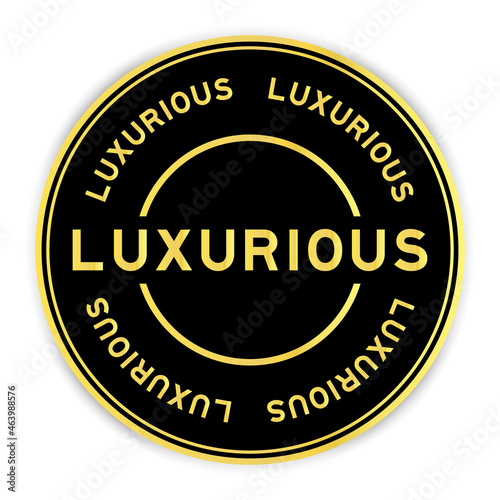 Black and gold color round label sticker with word luxurious on white background