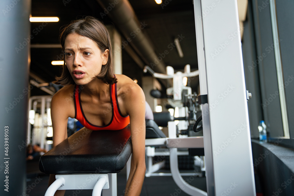 Portrait of happy fit woman exercise in gym to stay healthy Portrait of happy fit woman exercise in gym to stay healthy