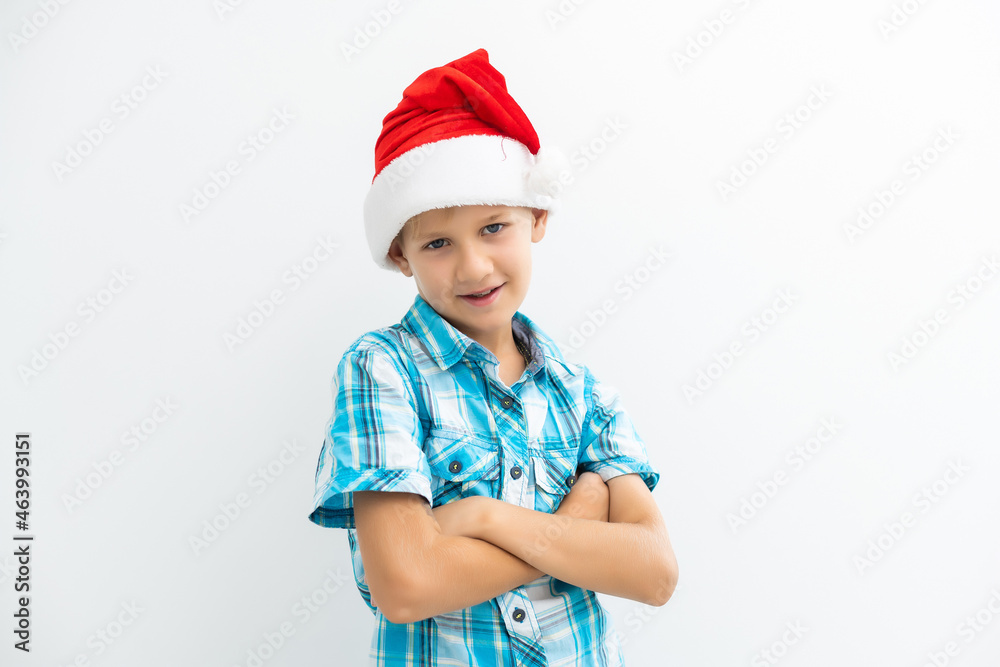 Boy dressed as Santa Claus isolated on white background Boy dressed as Santa Claus isolated on white background