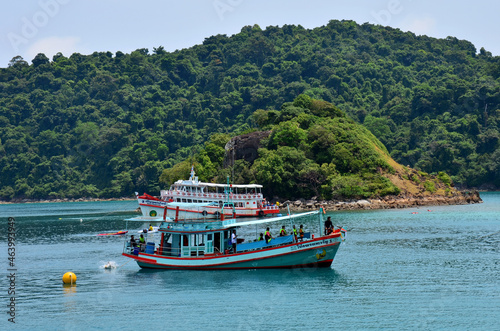 Ship cruise and boat tour for send receive thai people and foreign travelers travel visit rest relax and playing swimming water in sea ocean at Koh Chang island beach on May 28, 2011 in Trat, Thailand © tuayai