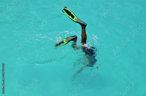 Thai people and foreign travelers travel visit swimming and snorkeling scuba diving see coral and beautiful fancy small fishes in sea ocean at Koh Chang island in gulf of thailand at Trat, Thailand