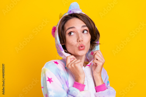 Photo portrait woman in costume dreamy looking copyspace in hood isolated bright yellow color background
