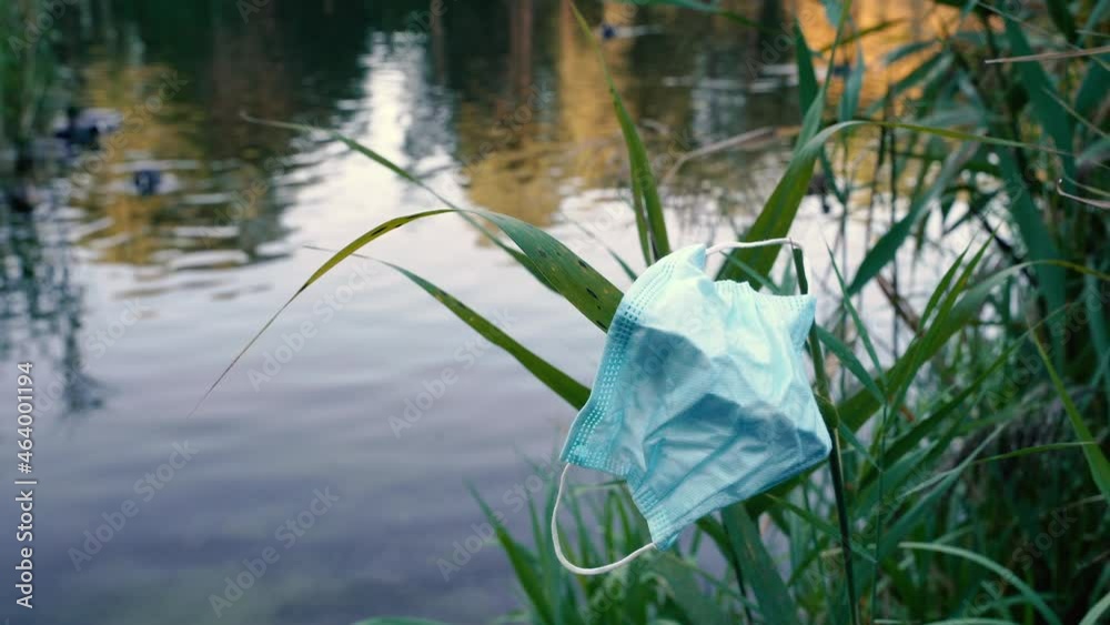 Medical mask. The medical mask was thrown out in the nature park.