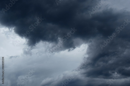 Dark grey threatening thunderclouds, rain clouds in the dark sky, weather change, summer thunderstorms, thunderclouds and rain clouds dark and grey, grey sky