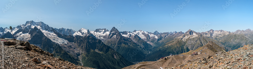 Karachay-Cherkess Republic, Russia. Panoramic view of the Caucasus Mountains and The Belalakaya peak. Ski camp in the middle of the mountains.