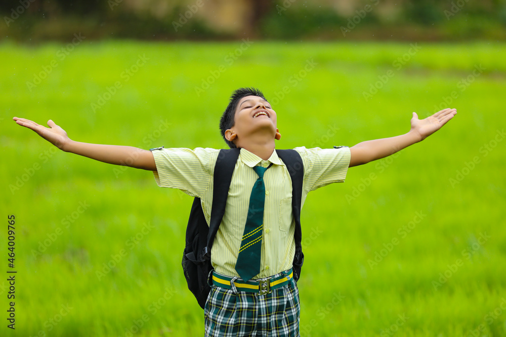 cute indian little school boy enjoying nature cute indian little school boy enjoying nature