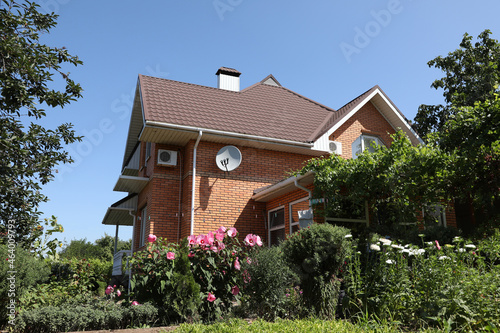 Beautiful view of modern cottage house outdoors