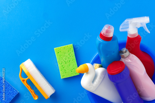 House cleaning supplies on blue color background