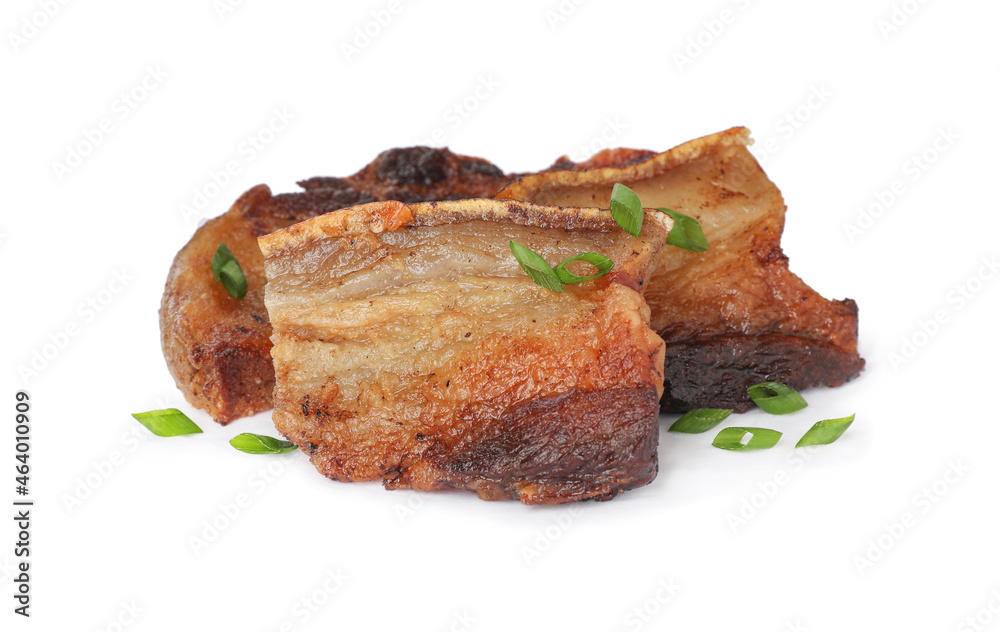 Tasty fried cracklings with parsley on white background. Cooked pork lard Tasty fried cracklings with parsley on white background. Cooked pork lard