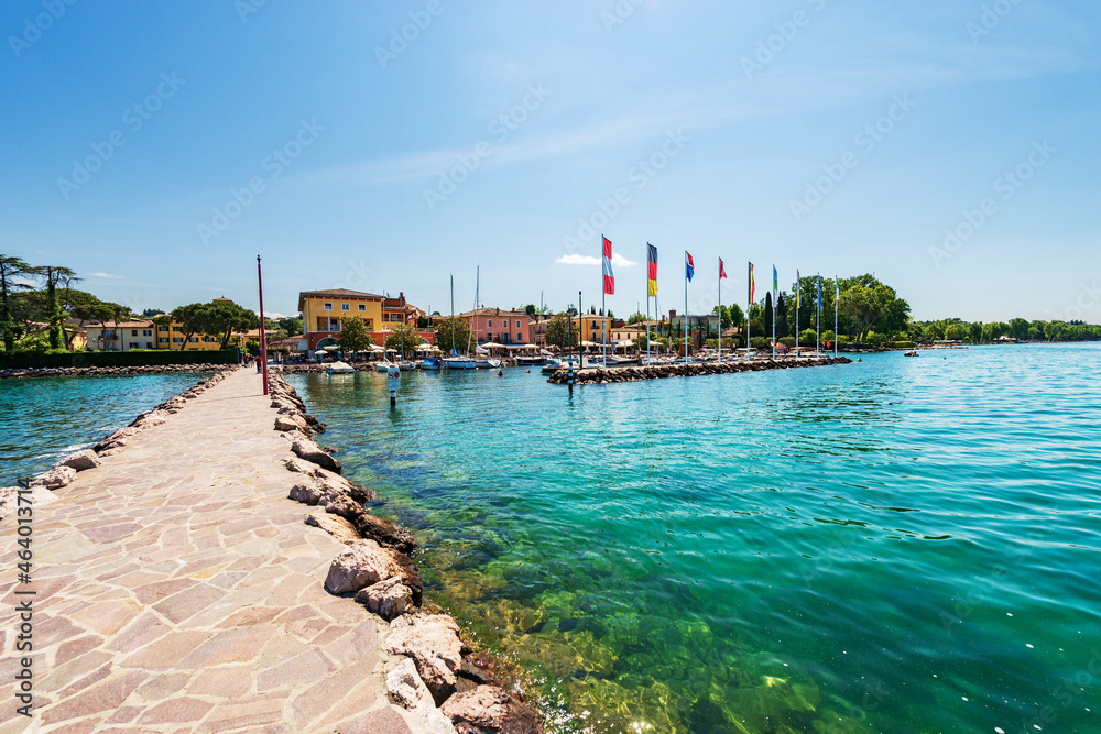 Small port of the village of Cisano with recreational boats moored. Tourist resort on the coast of Lake Garda (Lago di Garda). Bardolino municipality, Verona province, Veneto, Italy, southern Europe. 