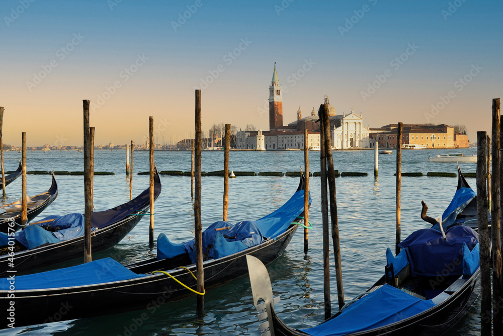 Venice gondola moored with the San Marco Maggiore church in the background