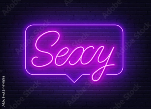Sexy neon sign in the speech bubble on brick wall background