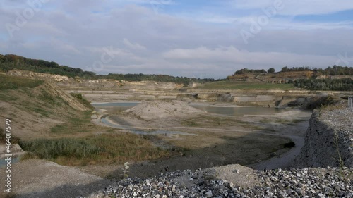 Abandoned Dutch Cement industry factory at chalk and limestone quarry in Limburg, the Netherlands in the morning sun photo