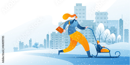A woman in warm clothes with a sled and a small child is walking against the background of a winter city. A template for a horizontal banner with a winter theme.