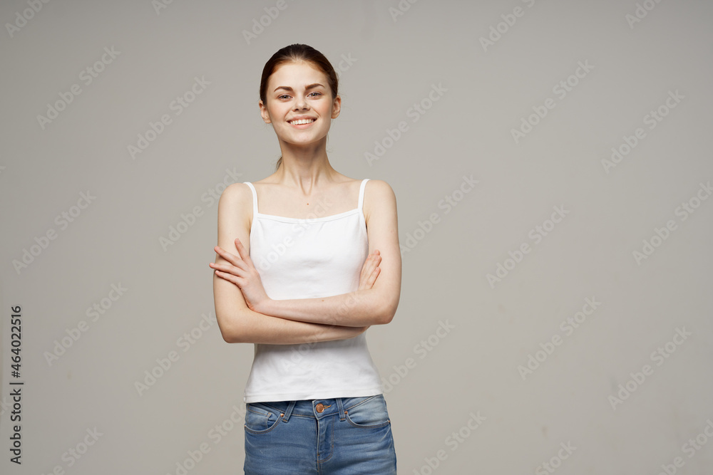 Joyful Woman in White T-shirt Joints Warm Up