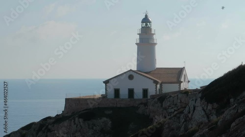 A lighthouse at coast of Cala Rajada in Mallorca, Spain photo