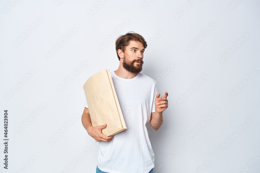 Cheerful man with beard paper craft bag packaging shopping Cheerful man with beard paper craft bag packaging shopping