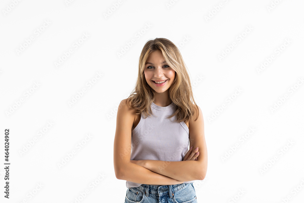 Young pretty woman posing and smiling over white background Young pretty woman posing and smiling over white background