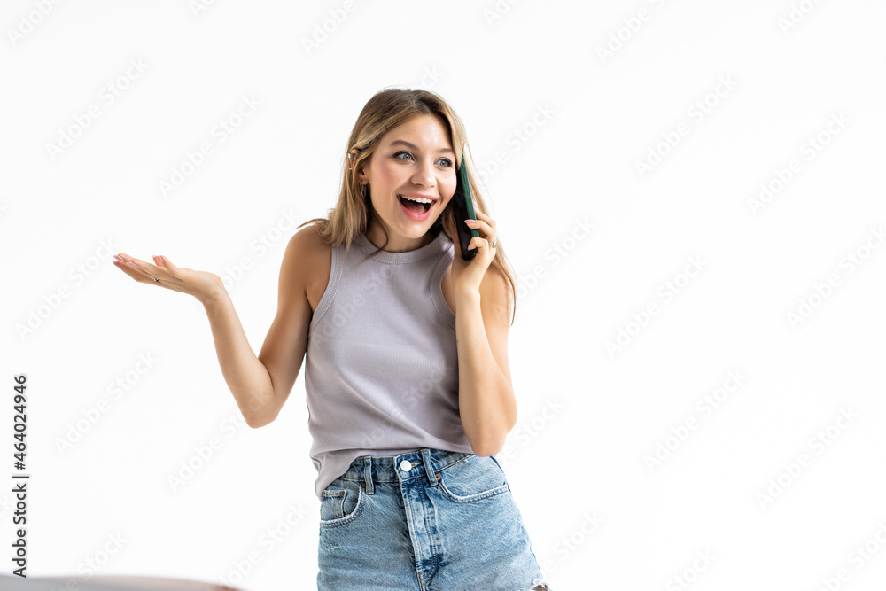 Young woman receiving only good news on mobile phone isolated on white background Young woman receiving only good news on mobile phone isolated on white background