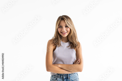 Young pretty woman posing and smiling over white background © F8  \ Suport Ukraine