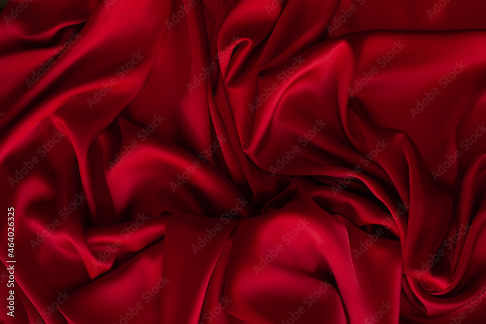 Red fabric texture background. Silk satin folds Red fabric texture background. Silk satin folds