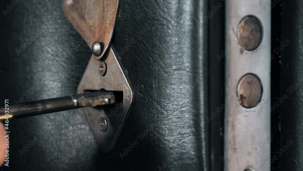 Closing the door with a key.Hand holding brass key and opens lock door.Black door. The key is inserted into the keyhole.Security of the house.The hand turns the key. Closing the door with a key.Hand holding brass key and opens lock door.Black door. The key is inserted into the keyhole.Security of the house.The hand turns the key.