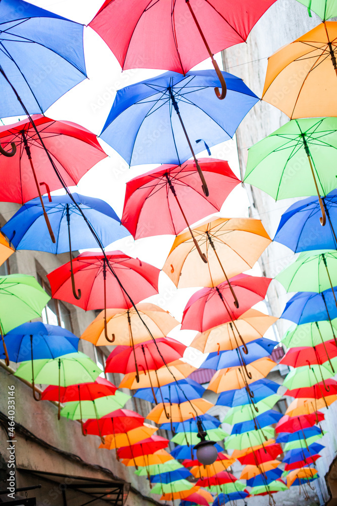 Obraz premium The colorful umbrellas in top of the street in the city