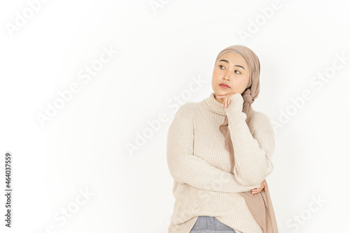 Thinking Gesture of Beautiful Asian Woman Wearing Hijab Isolated On White Background