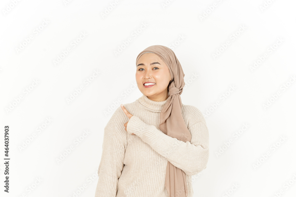 Presenting and Pointing Aside of Beautiful Asian Woman Wearing Hijab Isolated On White Background Presenting and Pointing Aside of Beautiful Asian Woman Wearing Hijab Isolated On White Background