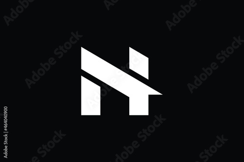 Logo design of N in vector for construction, home, real estate, building, property. creative elegant Monogram. Premium Business home logo icon. White color on black background.