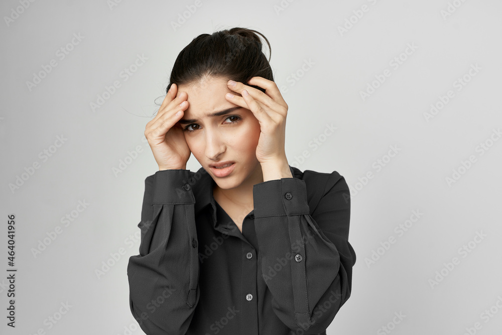 woman in black shirt holding his head depressed isolated background woman in black shirt holding his head depressed isolated background