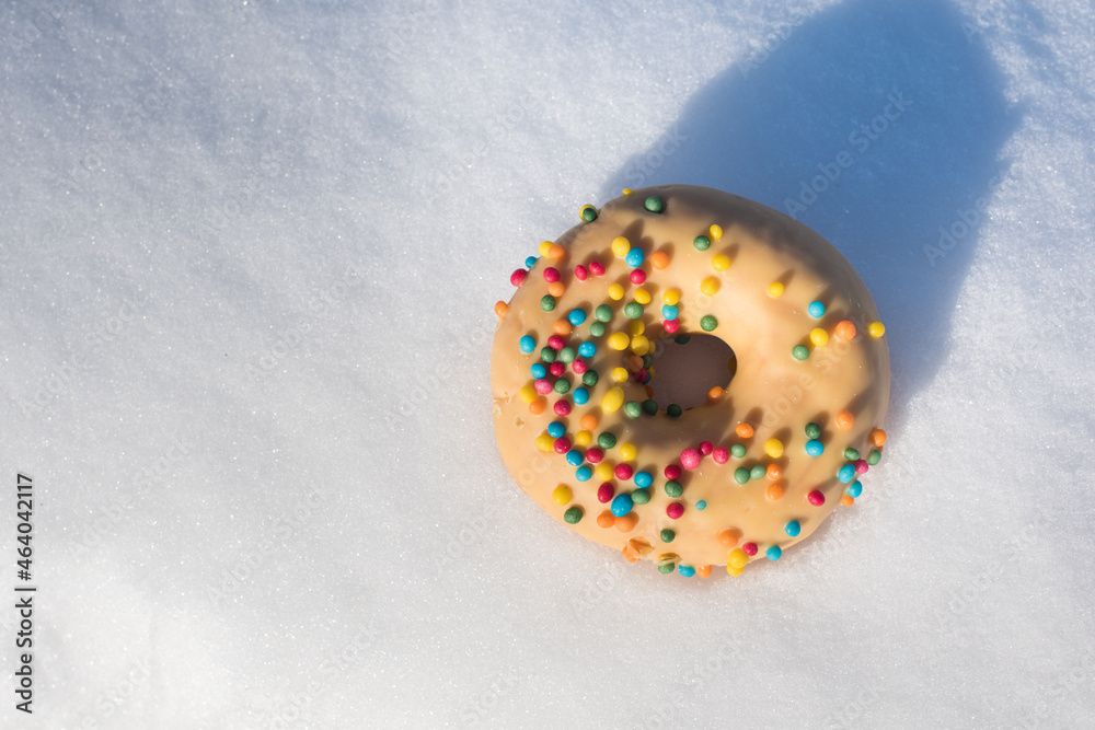 Sweet colorful glazed donuts with icing sprinkles