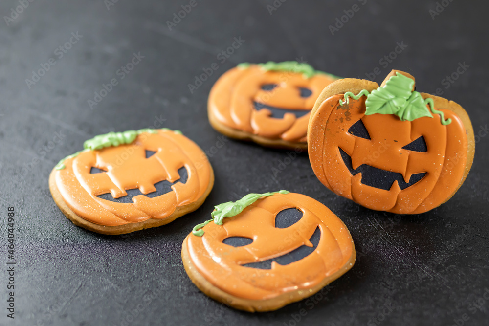 Bright happy Halloween gingerbread cookies on a black background Bright happy Halloween gingerbread cookies on a black background