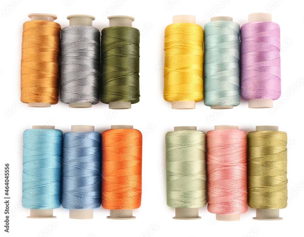 Set of colorful sewing threads on white background, top view Set of colorful sewing threads on white background, top view