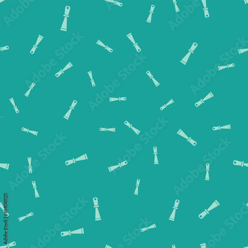 Green Putty knife icon isolated seamless pattern on green background. Spatula repair tool. Spackling or paint instruments. Vector