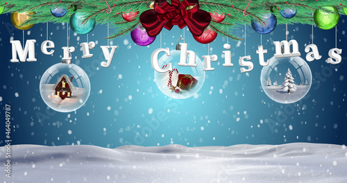 Merrry christmas text and hanging bauble decorations against snow falling over winter landscape photo