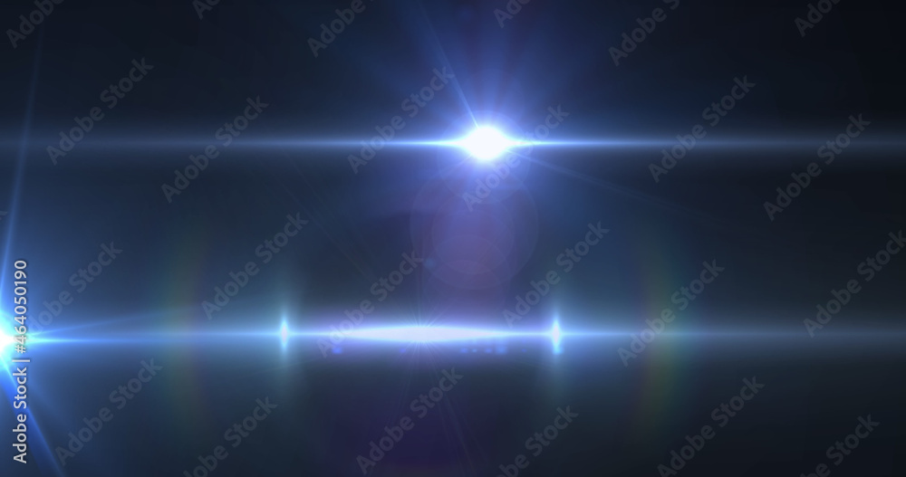 Image of light trails and spots over black background