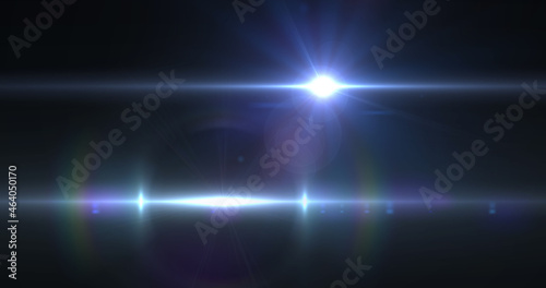 Image of light trails and spots over black background